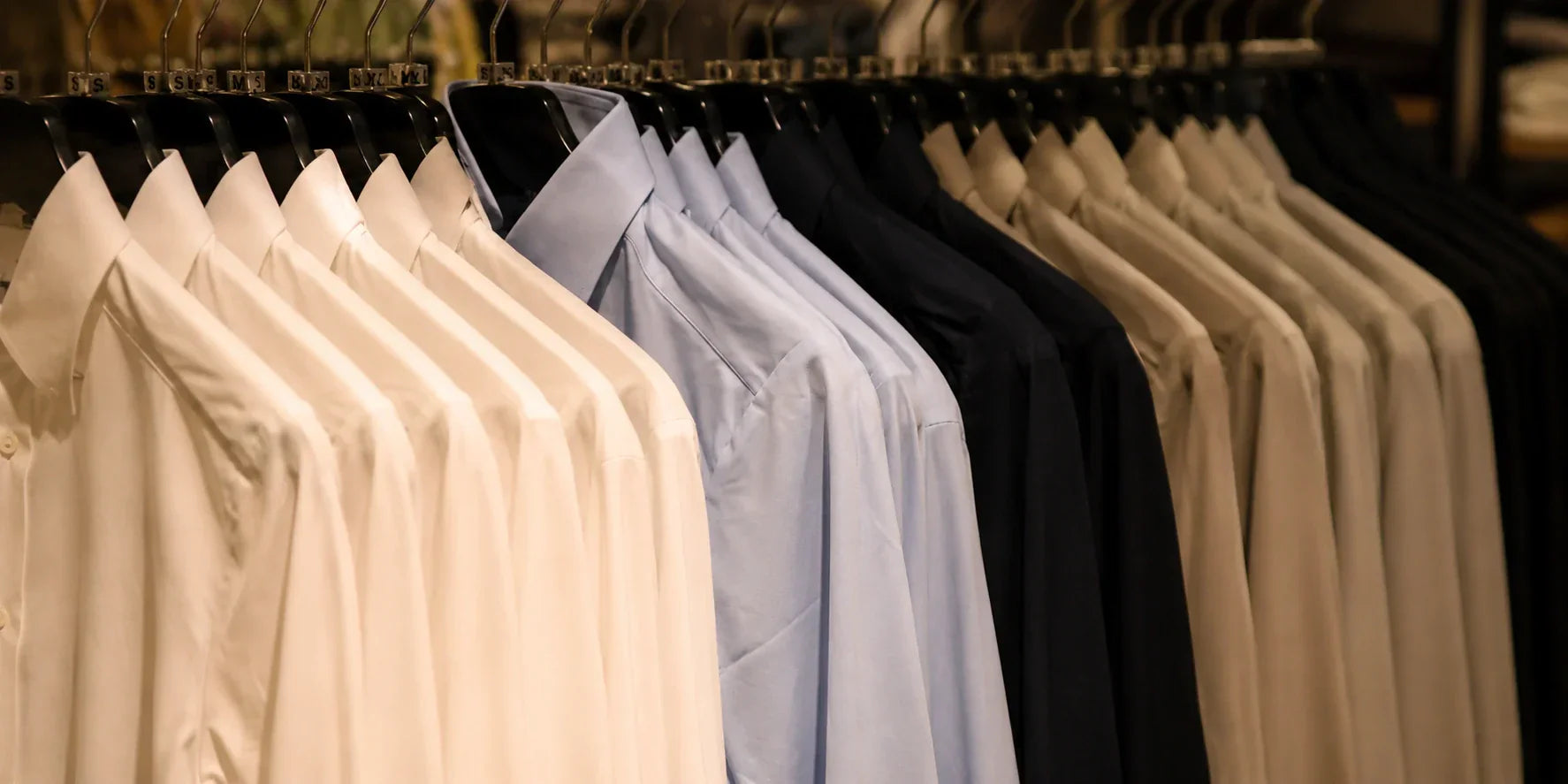 Clothing collection on display rack showcasing apparel ready for retail production